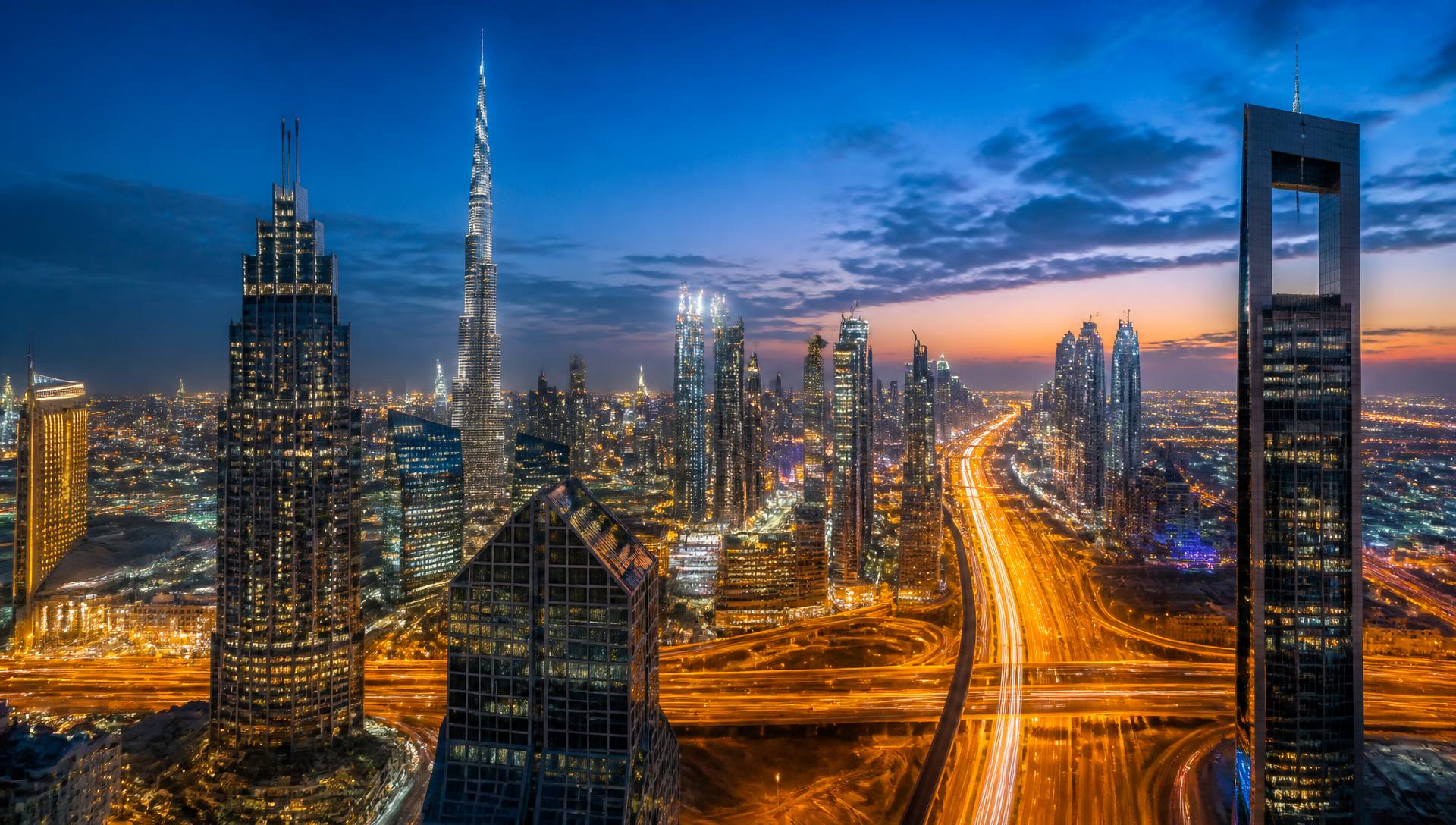 Aerial view of Downtown Dubai skyline and Sheikh Zayed Road at twilight
